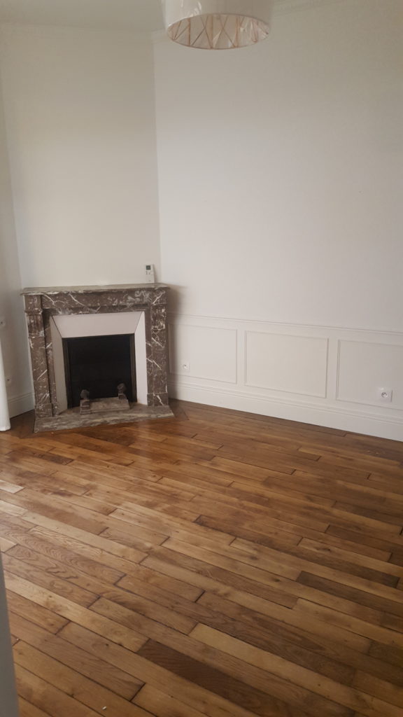 Renovation of an old house in France - the wooden floor and the moldings on the walls