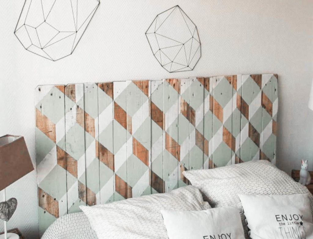 how to use upcycling in home decor: wood planks turned into a trendy headboard